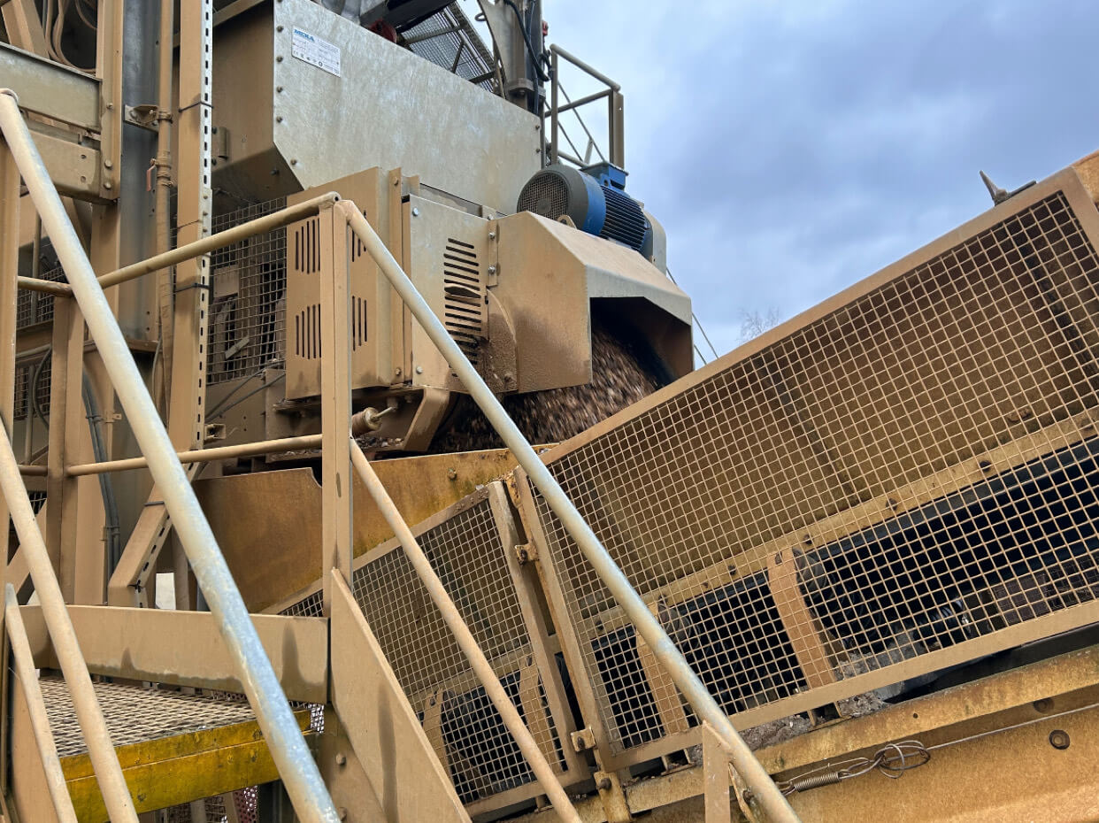 Concrete materials feeding onto conveyor belt at local Enfield batching plant