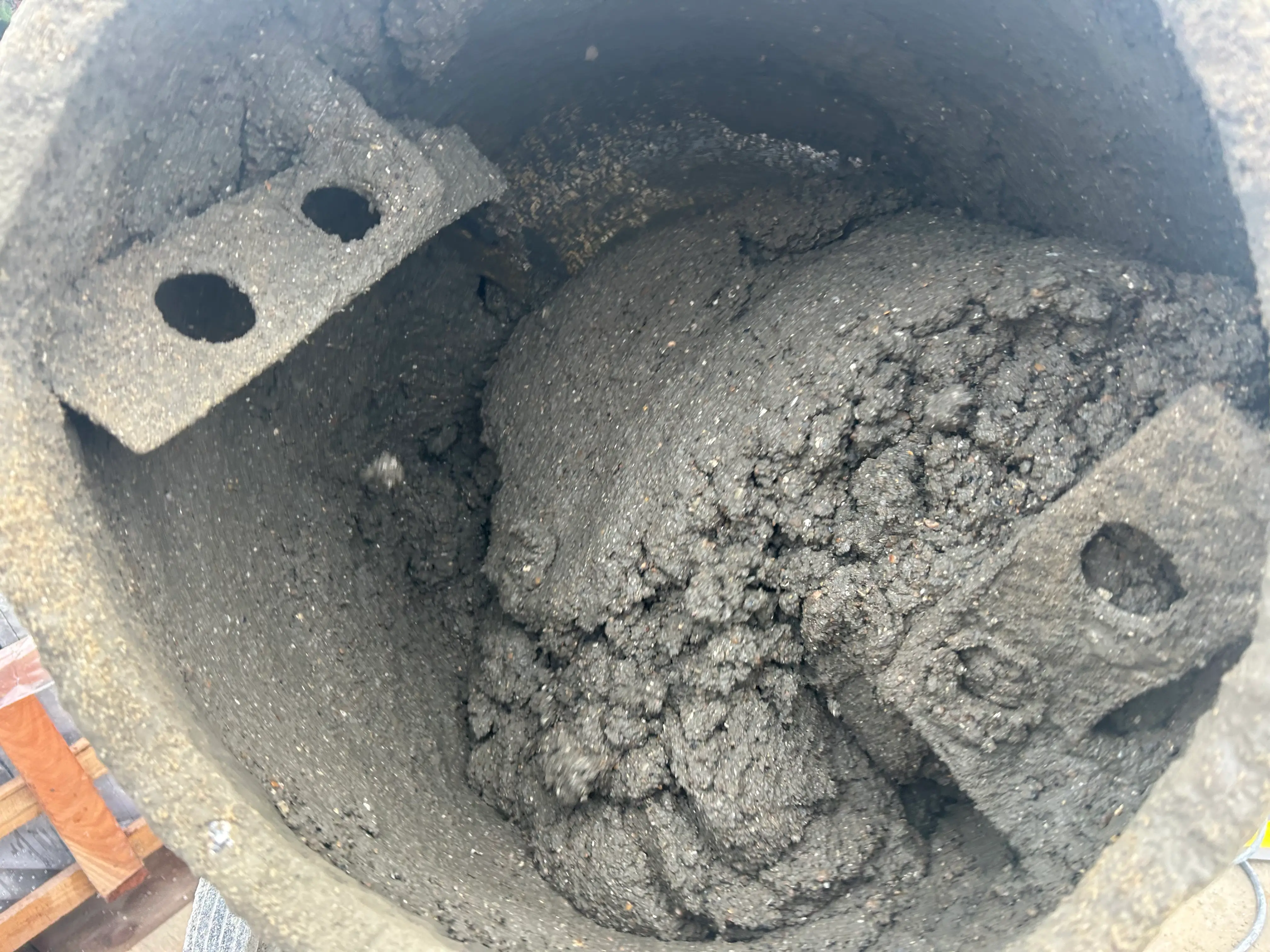 Concrete mixer preparing fresh concrete for base installation